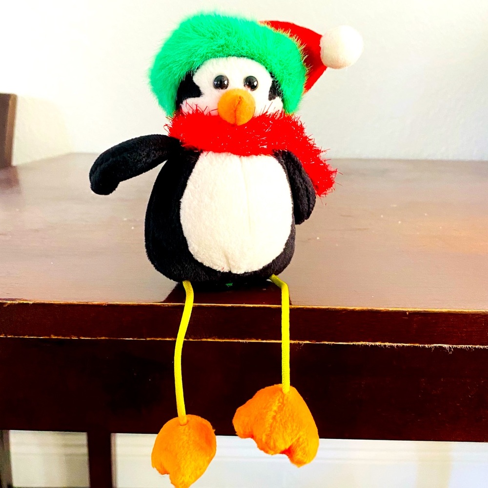 Christmas small penguin, dangling legs, Santa hat